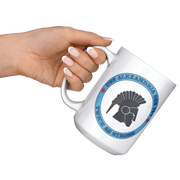 USS_ALexandria_FRG_15oz_Mug_15ozWhiteMugLifestyleLHRaisedAngle_Mockup.png_15831462
